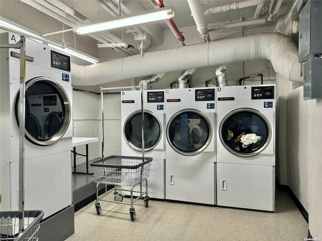 clothes washing area with washer and dryer