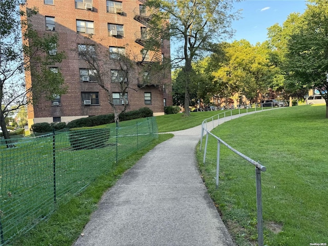 view of property's community with a lawn