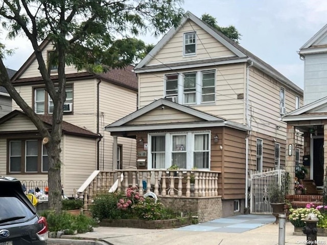 84-09 107th Ave, Ozone Park, NY 11417 - american foursquare style home featuring covered porch