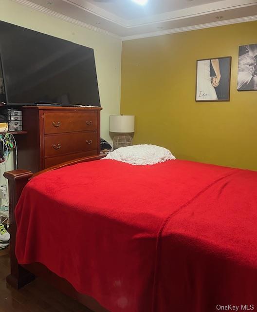 bedroom with ornamental molding