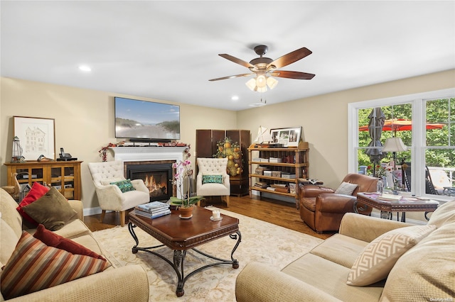 living room featuring ceiling fan and light wood-type flooring