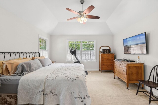 carpeted bedroom with ceiling fan and lofted ceiling