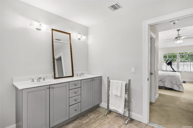 bathroom featuring ceiling fan and vanity