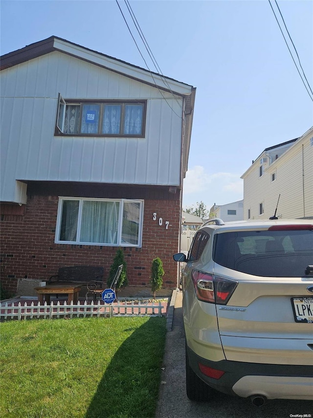 view of home's exterior featuring a lawn