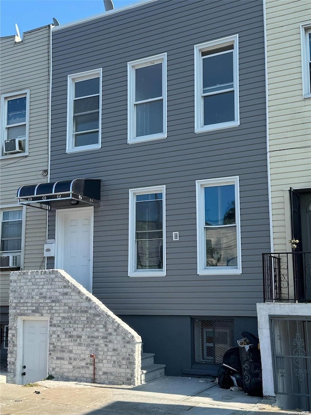 view of front of property featuring cooling unit