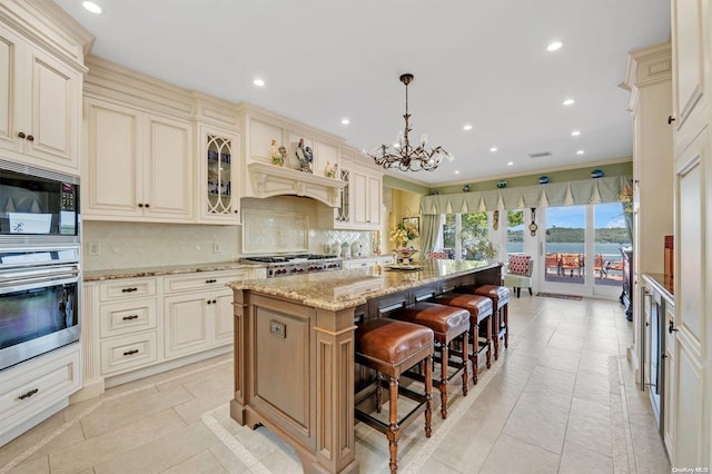 kitchen with a kitchen island and cream cabinetry