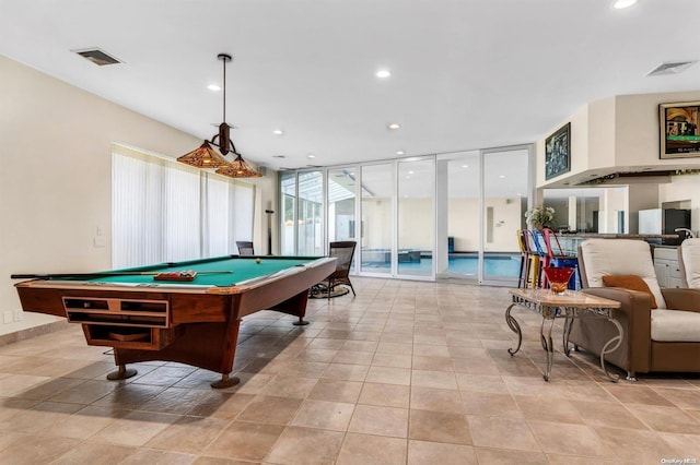 rec room featuring expansive windows, light tile patterned flooring, and billiards