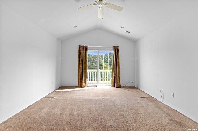 spare room featuring ceiling fan, carpet, and lofted ceiling