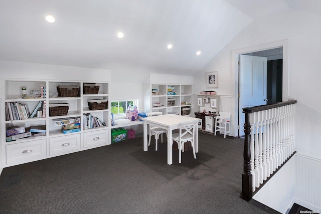 game room featuring dark colored carpet and lofted ceiling