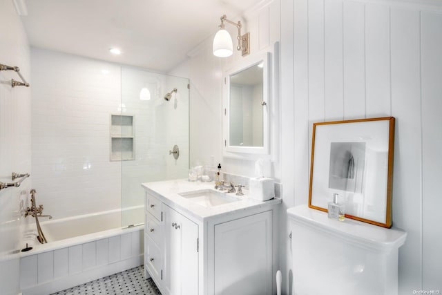 bathroom with vanity and tiled shower / bath combo