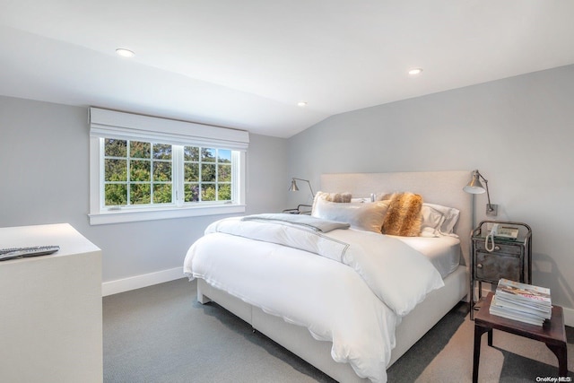 carpeted bedroom with vaulted ceiling