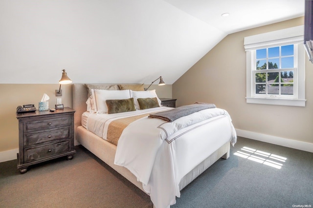 carpeted bedroom featuring lofted ceiling