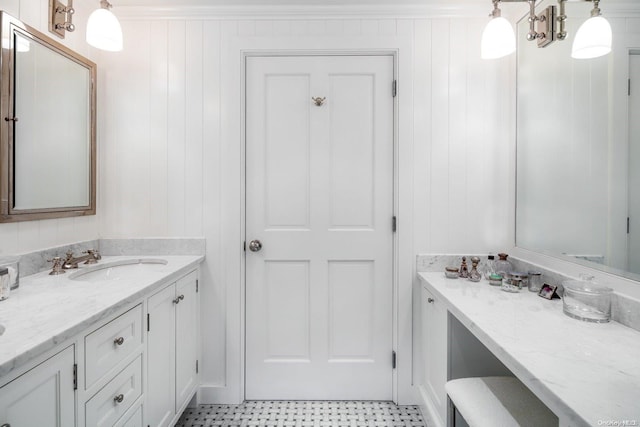 bathroom with wooden walls and vanity