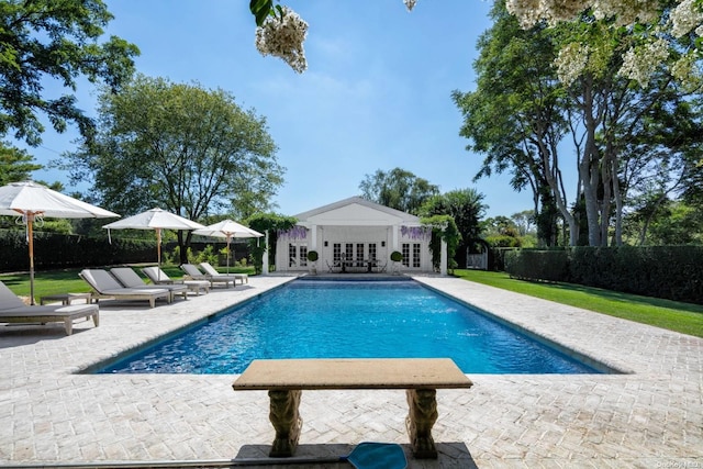 view of pool with a patio area and french doors