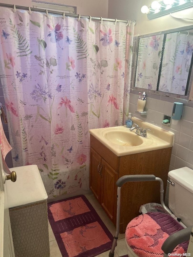 bathroom with tile patterned flooring, toilet, tile walls, and walk in shower