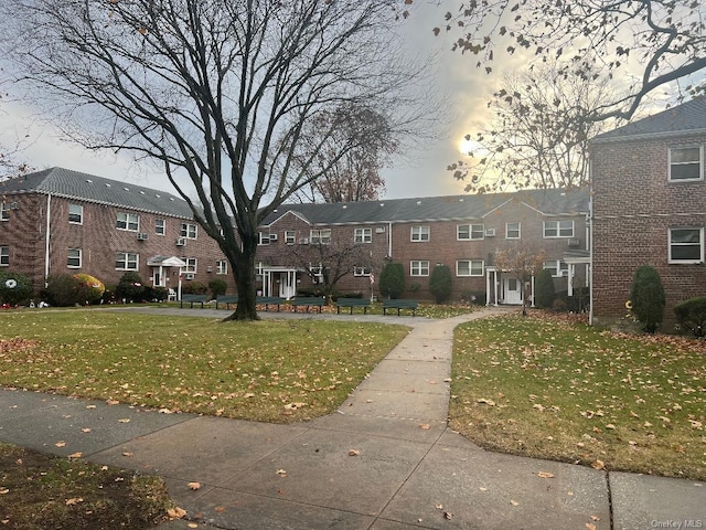 view of community featuring a yard