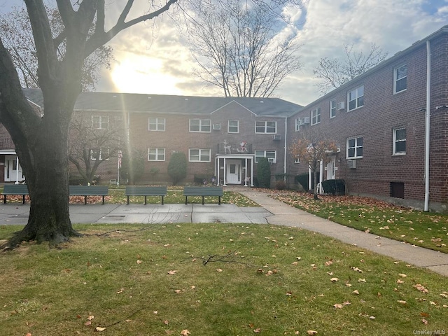 view of home's community with a lawn