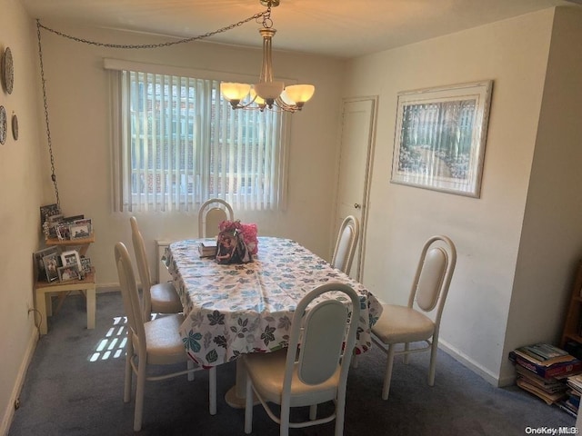 carpeted dining space with a chandelier