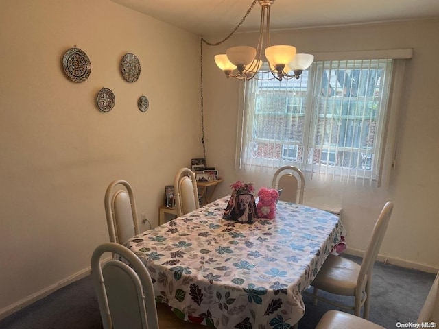 dining room with a chandelier, carpet, and a healthy amount of sunlight