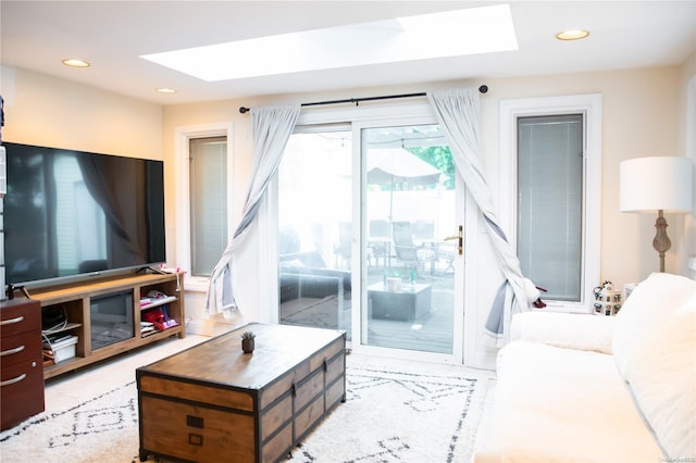 living room featuring a skylight