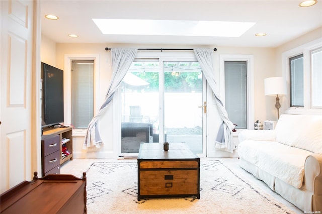 living room featuring a skylight