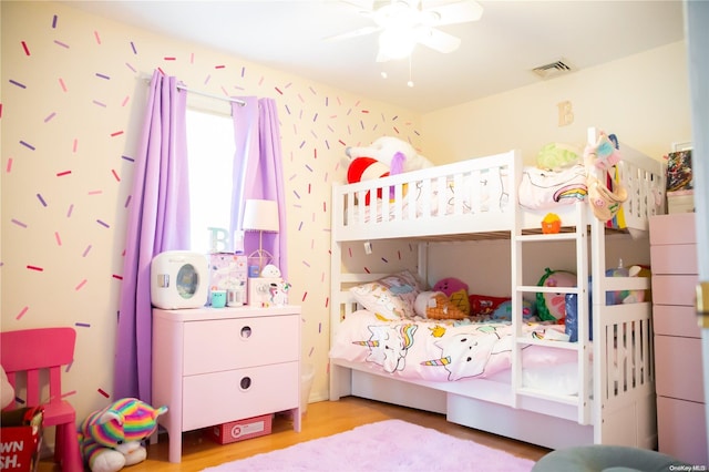 bedroom featuring ceiling fan and light hardwood / wood-style flooring