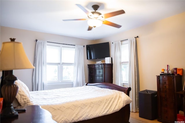 bedroom featuring ceiling fan and wood-type flooring