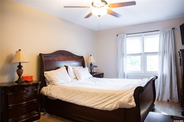 bedroom featuring hardwood / wood-style floors and ceiling fan