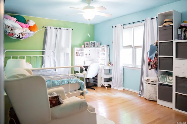 bedroom featuring ceiling fan and light hardwood / wood-style flooring