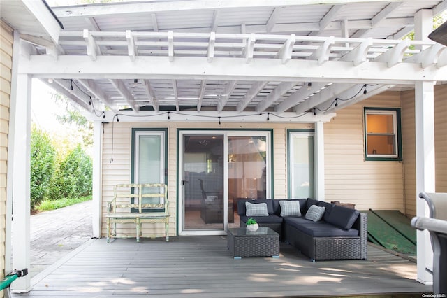 wooden deck featuring an outdoor hangout area and a pergola