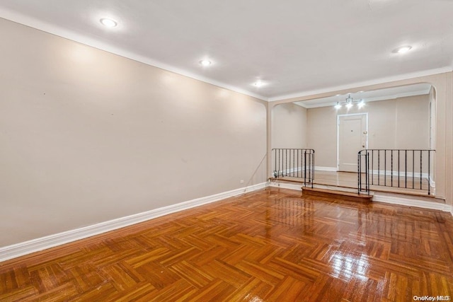 unfurnished room featuring parquet flooring