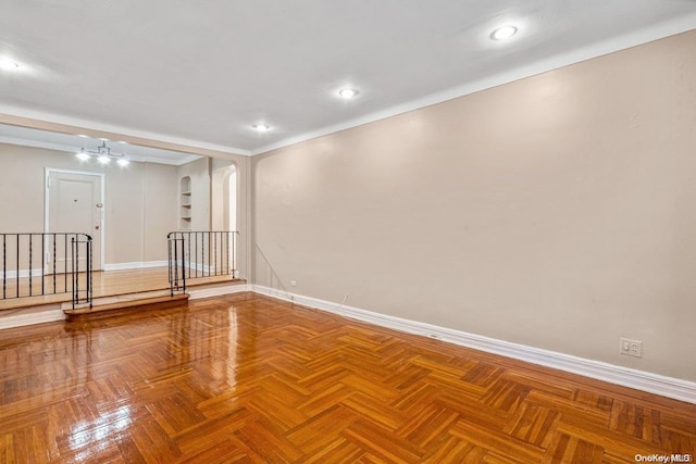 empty room with parquet flooring