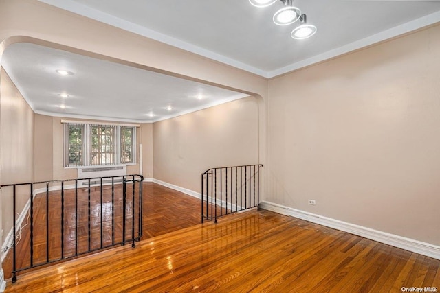 unfurnished room with hardwood / wood-style flooring