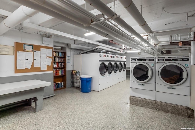 clothes washing area with washing machine and clothes dryer