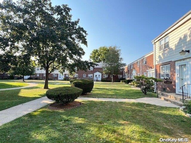 view of community featuring a lawn