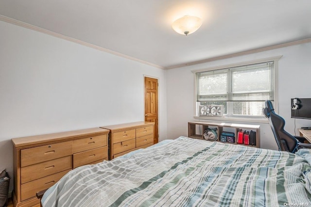 bedroom featuring crown molding