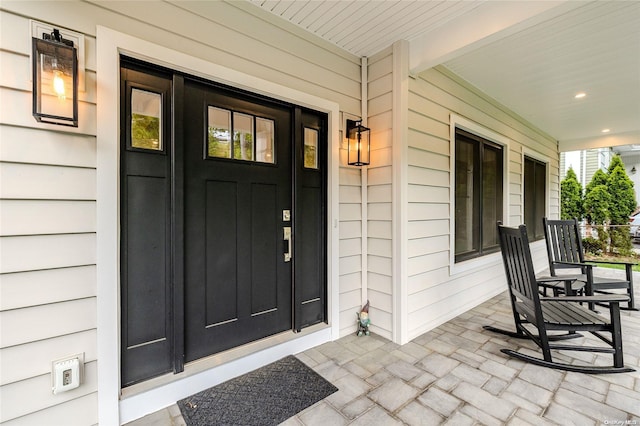 entrance to property with a porch