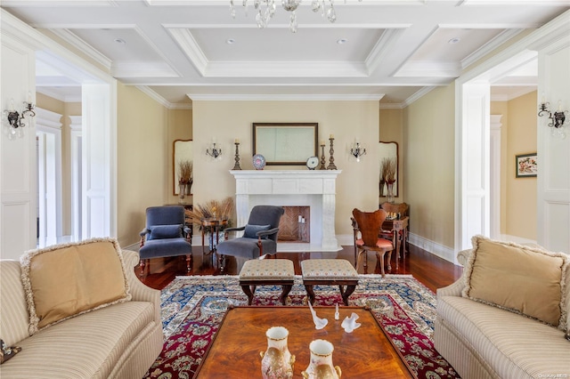 living room with wood-type flooring, crown molding, and coffered ceiling