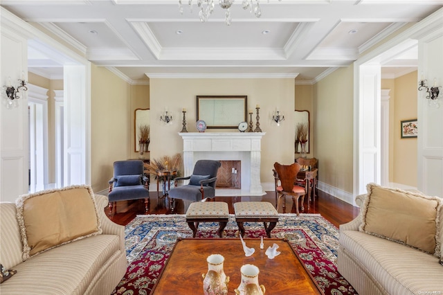 11 Dupont Ct, Brookville, NY 11548 - living room with coffered ceiling, wood finished floors, crown molding, a fireplace with flush hearth, and a chandelier