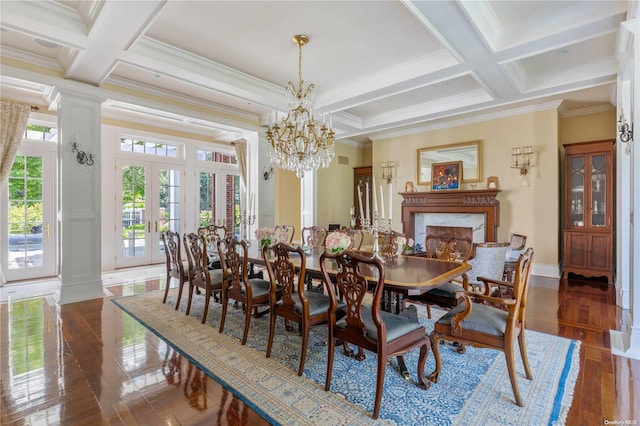 dining room with coffered ceiling, ornamental molding, beamed ceiling, and french doors