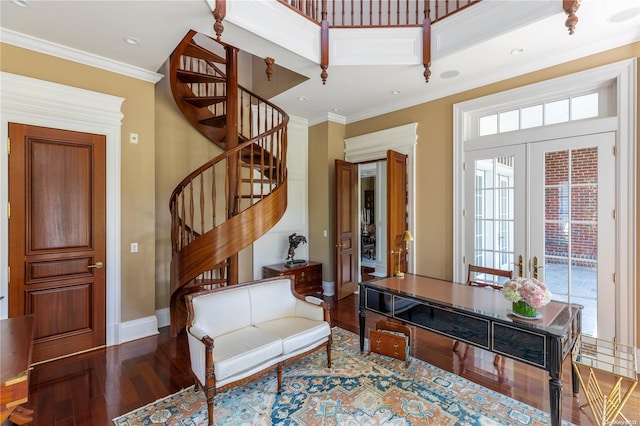 foyer entrance with french doors, hardwood / wood-style flooring, and ornamental molding