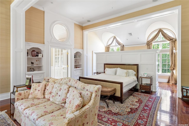 11 Dupont Ct, Brookville, NY 11548 - bedroom with dark wood-style flooring and crown molding