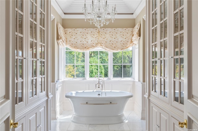 11 Dupont Ct, Brookville, NY 11548 - full bathroom with a decorative wall, marble look tile flooring, a freestanding tub, a chandelier, and wainscoting