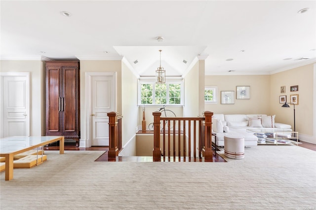 sitting room featuring crown molding, wood-type flooring, and lofted ceiling