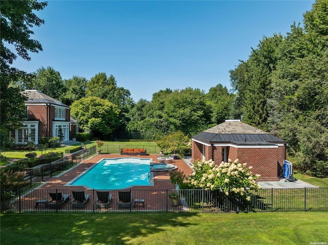 view of pool with a yard