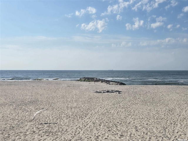 view of water feature with a beach view