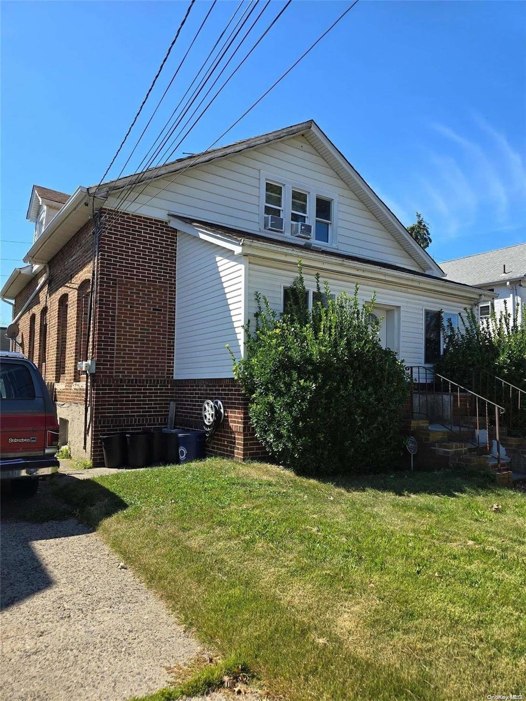 view of property exterior with a lawn