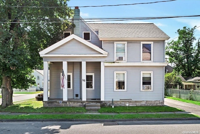 view of front of property featuring cooling unit and covered porch