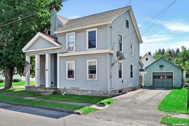 view of front of house with an outbuilding, cooling unit, and a garage