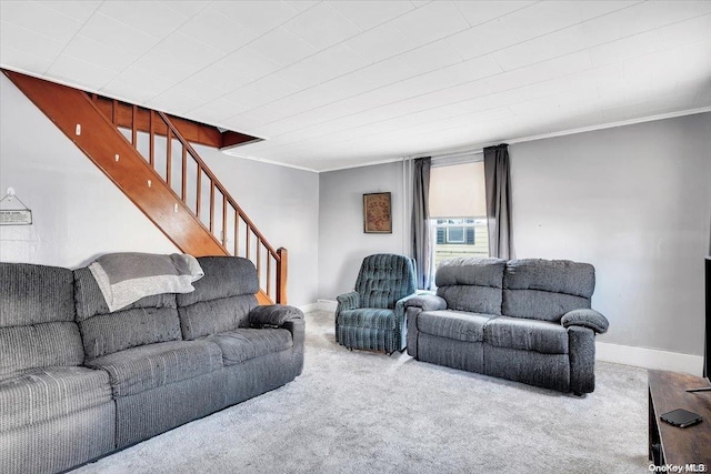 living room with carpet flooring and ornamental molding